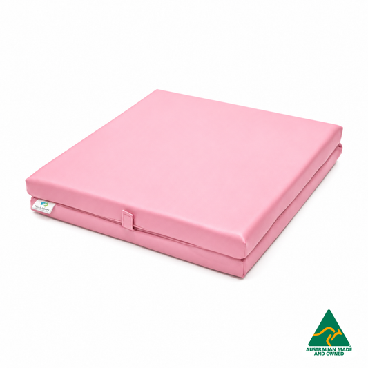 Folded Baby Pink Foldable Hello Comfy Child Care Sleep Mat made from waterproof PVC vinyl and foam, tested to AS/NZS 8811.1:2013, Australian-made for daycare and child care use