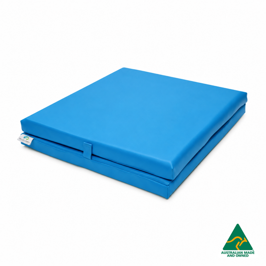 Folded Blue Foldable Hello Comfy Child Care Sleep Mat made from waterproof PVC vinyl and foam, tested to AS/NZS 8811.1:2013, Australian-made for daycare and child care use