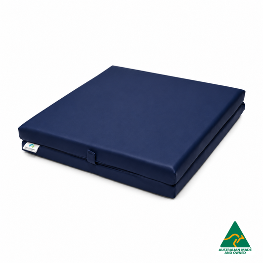 Folded Navy Foldable Hello Comfy Child Care Sleep Mat made from waterproof PVC vinyl and foam, tested to AS/NZS 8811.1:2013, Australian-made for daycare and child care use