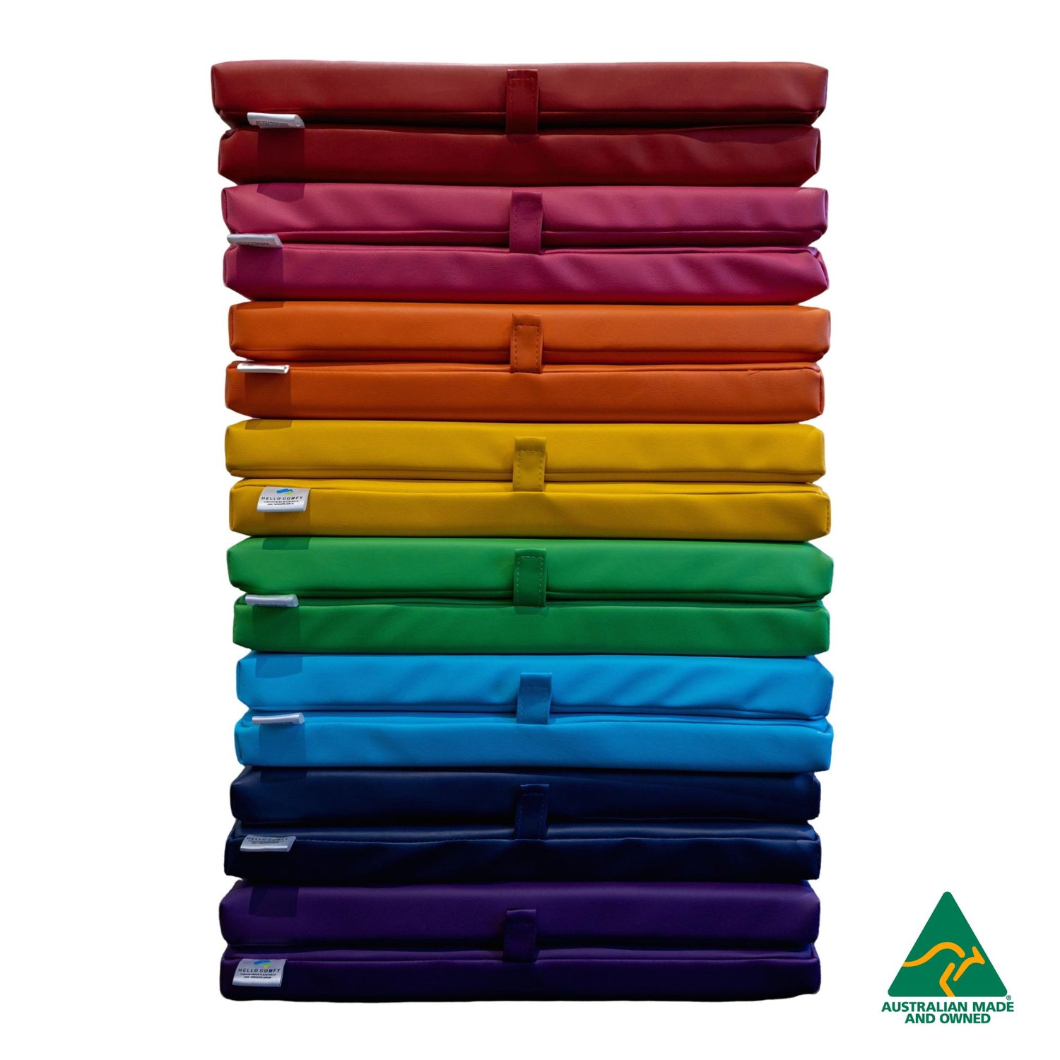 Stack of Red, Pink, Orange, yellow, Green, Blue, Navy and Purple Hello Comfy Foldable Child Care Sleep Mats made from waterproof PVC vinyl and foam, tested to AS/NZS 8811.1:2013, Australian-made for daycare and child care use