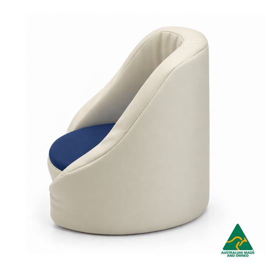 Side view of the Navy Hello Comfy Child Care Cuddle Chair with a removable circular foam seat cushion, waterproof PVC vinyl upholstery and supportive chair backing. Made in Australia for child care centres, kindergartens, schools and daycare environments.