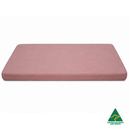 Side view of a Marshmallow Pink Hello Comfy 100% cotton fitted bottom sheet for a child care sleep mat, fully elasticated and Australian made for daycare centres.