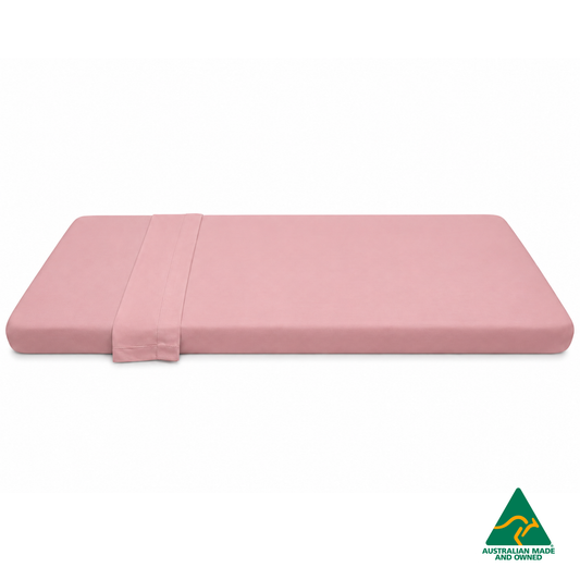 Side view of Marshmallow Pink Hello Comfy 100% cotton sleep mat sheet set with fitted and flat sheet, elastic-fitted, Australian-made for daycare and child care centres