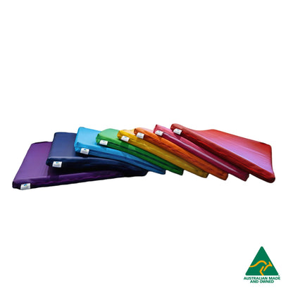 Fan spread of Red, Pink, Orange, yellow, Green, Blue, Navy and Purple Hello Comfy Child Care Sleep Mats made from waterproof PVC vinyl and foam, tested to AS/NZS 8811.1:2013, Australian-made for daycare and child care use