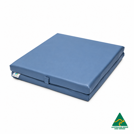 Folded Denim Blue Foldable Hello Comfy Child Care Sleep Mat made from waterproof PVC vinyl and foam, tested to AS/NZS 8811.1:2013, Australian-made for daycare and child care use