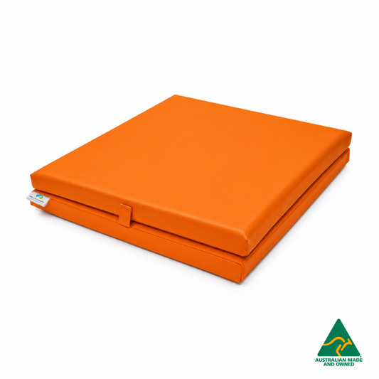 Folded Orange Foldable Hello Comfy Child Care Sleep Mat made from waterproof PVC vinyl and foam, tested to AS/NZS 8811.1:2013, Australian-made for daycare and child care use