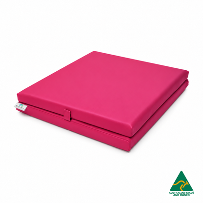 Folded Pink Foldable Hello Comfy Child Care Sleep Mat made from waterproof PVC vinyl and foam, tested to AS/NZS 8811.1:2013, Australian-made for daycare and child care use