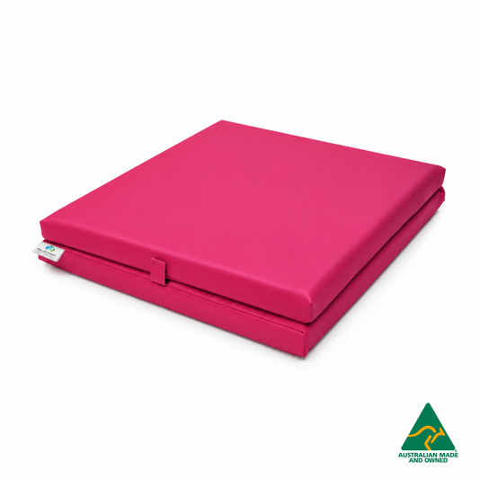 Folded Pink Foldable Hello Comfy Child Care Sleep Mat made from waterproof PVC vinyl and foam, tested to AS/NZS 8811.1:2013, Australian-made for daycare and child care use