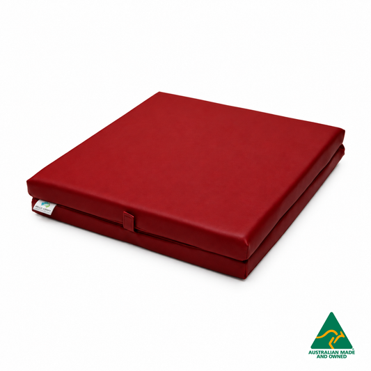 Folded Red Foldable Hello Comfy Child Care Sleep Mat made from waterproof PVC vinyl and foam, tested to AS/NZS 8811.1:2013, Australian-made for daycare and child care use