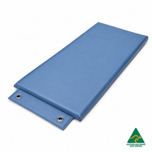Angled view of the Denim Blue Hello Comfy Hanging Child Care Sleep Mat with two reinforced eyelets, waterproof vinyl and foam tested to AS/NZS 8811.1:2013, Australian-made for child care, kindergarten, school and daycare use.