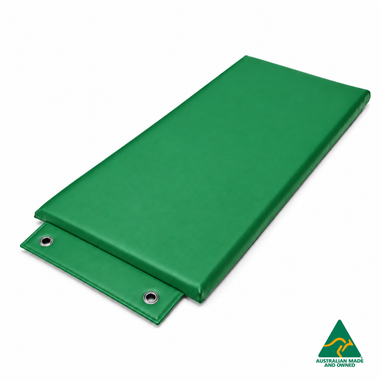 Angled view of the Green Hello Comfy Hanging Child Care Sleep Mat with two reinforced eyelets, waterproof vinyl and foam tested to AS/NZS 8811.1:2013, Australian-made for child care, kindergarten, school and daycare use.