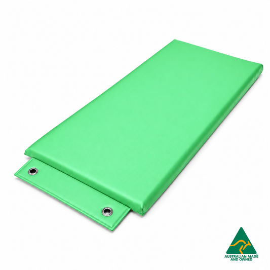 Angled view of the Mint Green Hello Comfy Hanging Child Care Sleep Mat with two reinforced eyelets, waterproof vinyl and foam tested to AS/NZS 8811.1:2013, Australian-made for child care, kindergarten, school and daycare use.