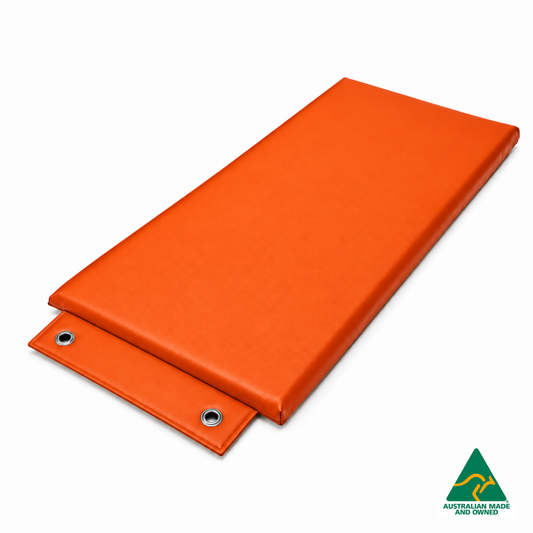 Angled view of the Orange Hello Comfy Hanging Child Care Sleep Mat with two reinforced eyelets, waterproof vinyl and foam tested to AS/NZS 8811.1:2013, Australian-made for child care, kindergarten, school and daycare use.