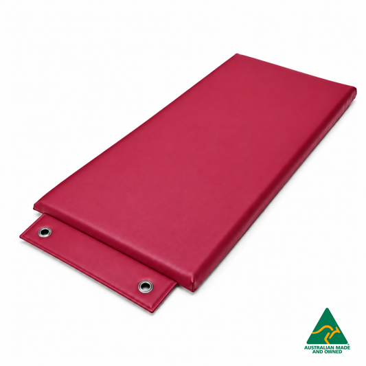 Angled view of the Pink Hello Comfy Hanging Child Care Sleep Mat with two reinforced eyelets, waterproof vinyl and foam tested to AS/NZS 8811.1:2013, Australian-made for child care, kindergarten, school and daycare use.