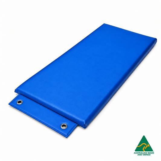 Angled view of the Royal Blue Hello Comfy Hanging Child Care Sleep Mat with two reinforced eyelets, waterproof vinyl and foam tested to AS/NZS 8811.1:2013, Australian-made for child care, kindergarten, school and daycare use.