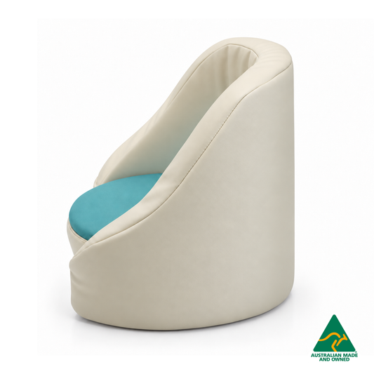 Side view of the Aqua Hello Comfy Child Care Cuddle Chair with a removable circular foam seat cushion, waterproof PVC vinyl upholstery and supportive chair backing. Made in Australia for child care centres, kindergartens, schools and daycare environments.
